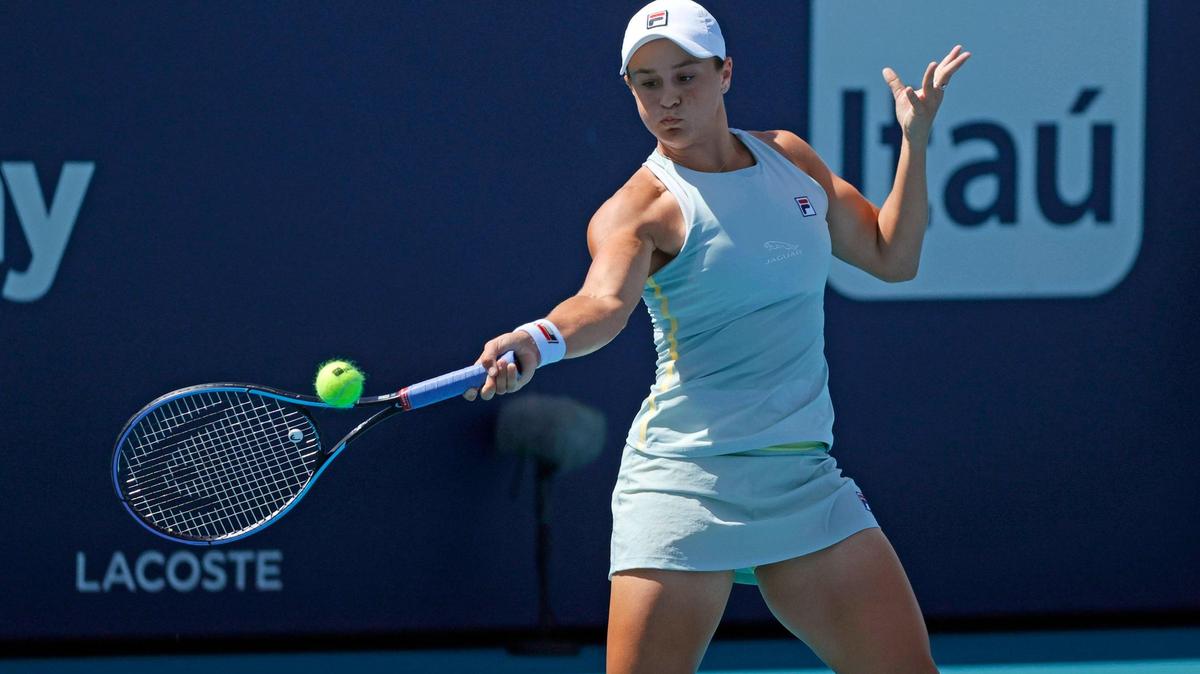 Ashleigh Barty of Australia returns to Jelena Ostapenko of Latvia during their match at the Miami Open tennis tournament at Hard Rock Stadium on Saturday, March 27, 2021, in Miami Gardens, Fl.