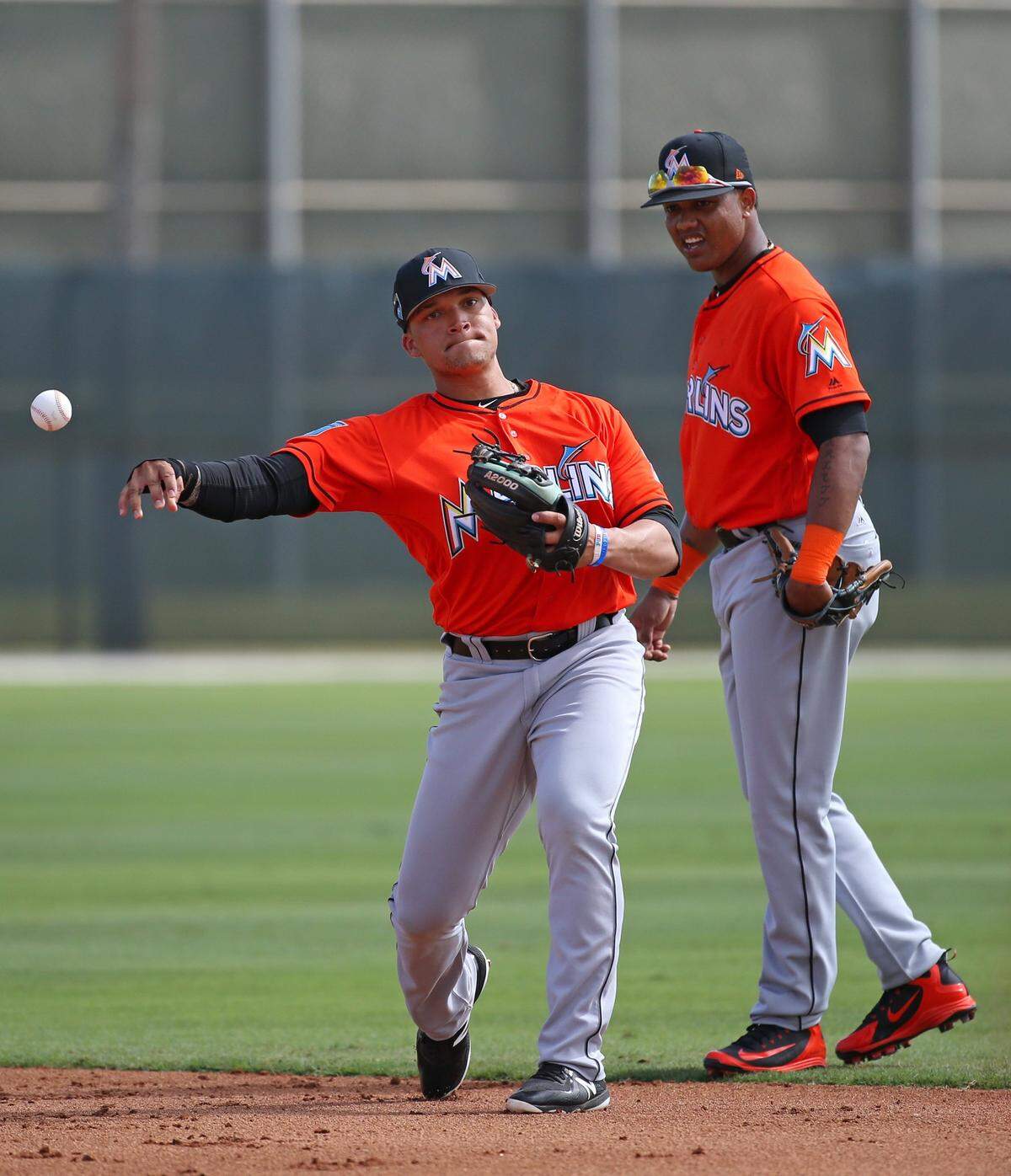 Miami Marlins infielder Isan Diaz throws to first base during defensive drills the spring training baseball workouts at Roger Dean Stadium on Tuesday, February 20, 2018 in Jupiter, FL.