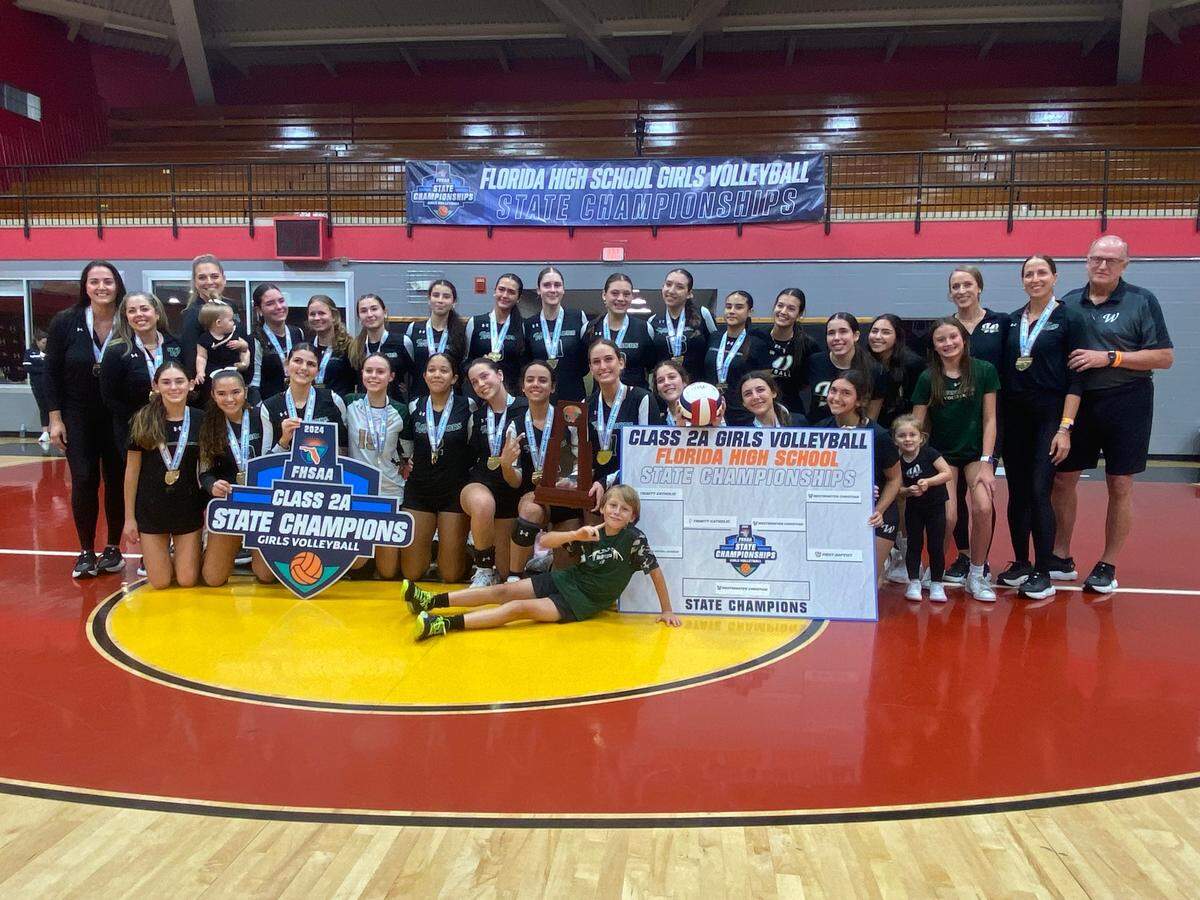 The Westminster Christian volleyball team celebrates after beating Ocala Trinity Catholic on Wednesday night to win its third state title and first since 2016.