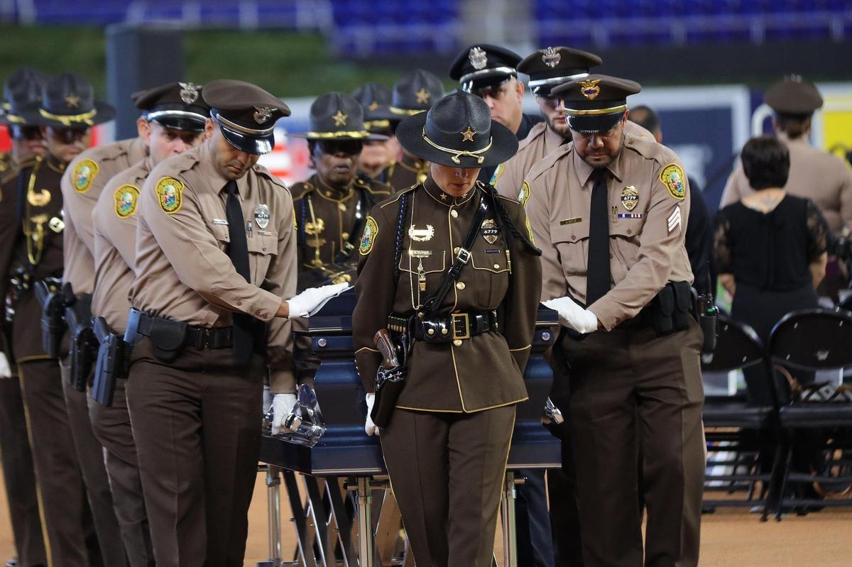 The casket is ushered to the hearse parked inside loanDepot park by pallbearers at the end of the memorial service. On Wednesday, Aug. 24, 2022, a memorial was held in honor of Officer Cesar “Echy” Echaverry The Miami-Dade Police Department, Mayor Daniella Levine Cava, the Board of County Commissioners, and members of the community honored Echaverry’s life and service.