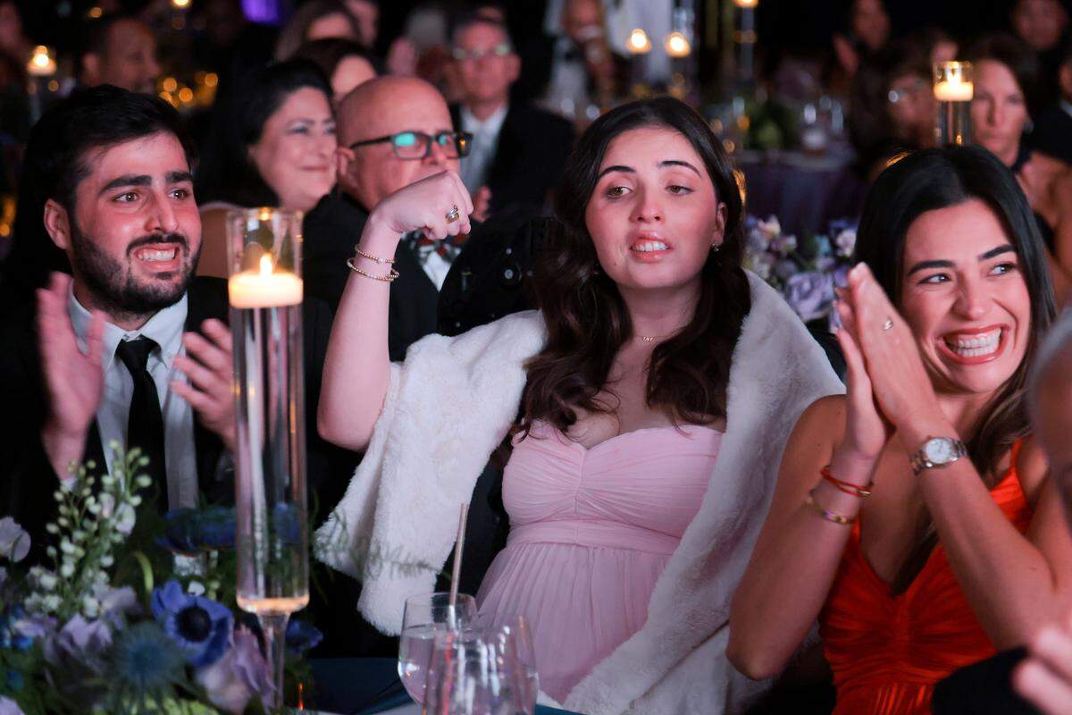 Boating accident survivor Katerina “Katy” Puig, center, reacts as she is honored during the Nicklaus Children's Foundation Diamond Ball at the JW Marriott Marquis in Downtown Miami, Saturday, October 18, 2025.