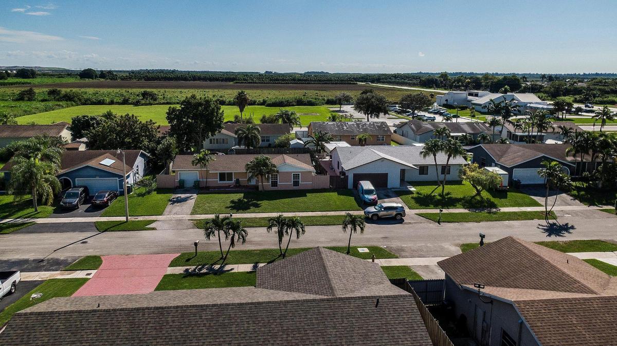 View of a neighborhood next to a field located at 26100 SW 112th Ave, Homestead. County officials, residents, and developers have fought to expand Homestead’s boundary into protected land.