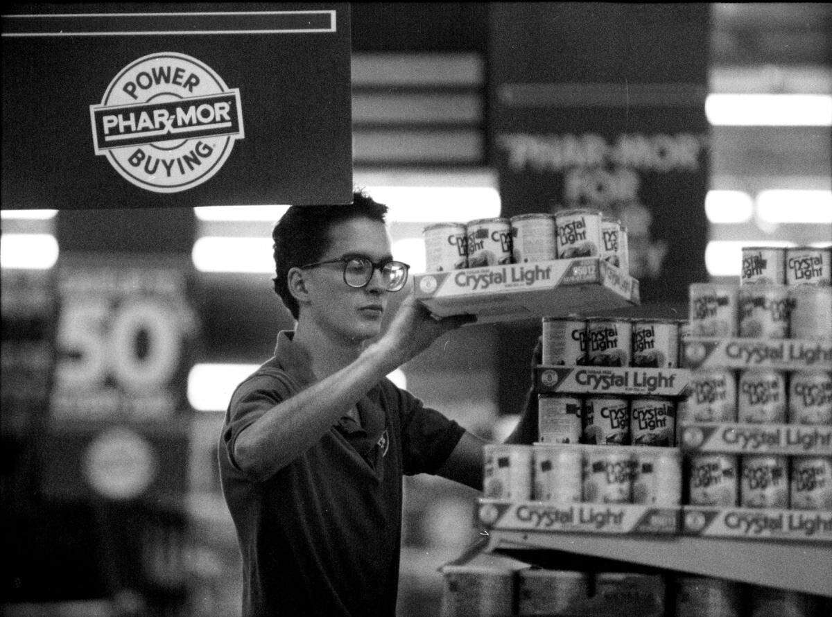 A manager stocks the shelves ay Phar-Mor at Sawgrass Mills mall.