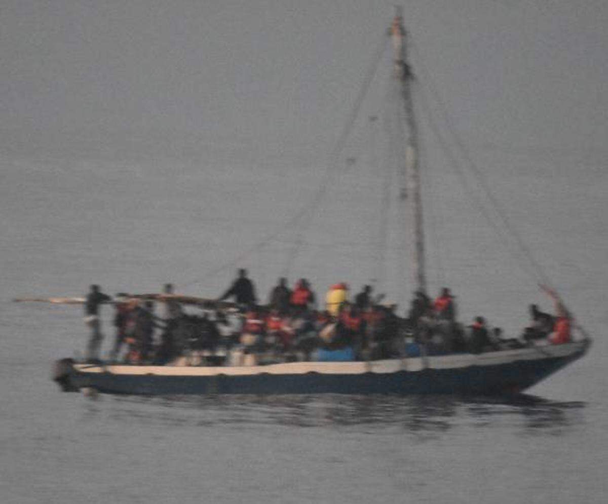Almost 90 people crowd the deck of an overloaded sailboat about 17 miles off Cuba’s southeastern coast Saturday, April 9, 2022. The Coast Guard returned the migrants back to Haiti Tuesday, April 12, 2022.