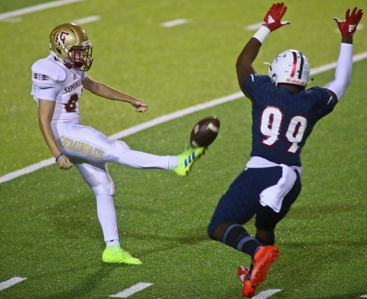 Chaminade-Madonna defensive end Jamaal Johnson (99) tries to block a punt by Florida High kicker Cameron McCormick (81) in the first quarter of their FHSAA Class 3A Football State Championship Friday, Dec. 6, 2019 in Tallahassee, Fla. Chaminade-Madonna won 35-20.