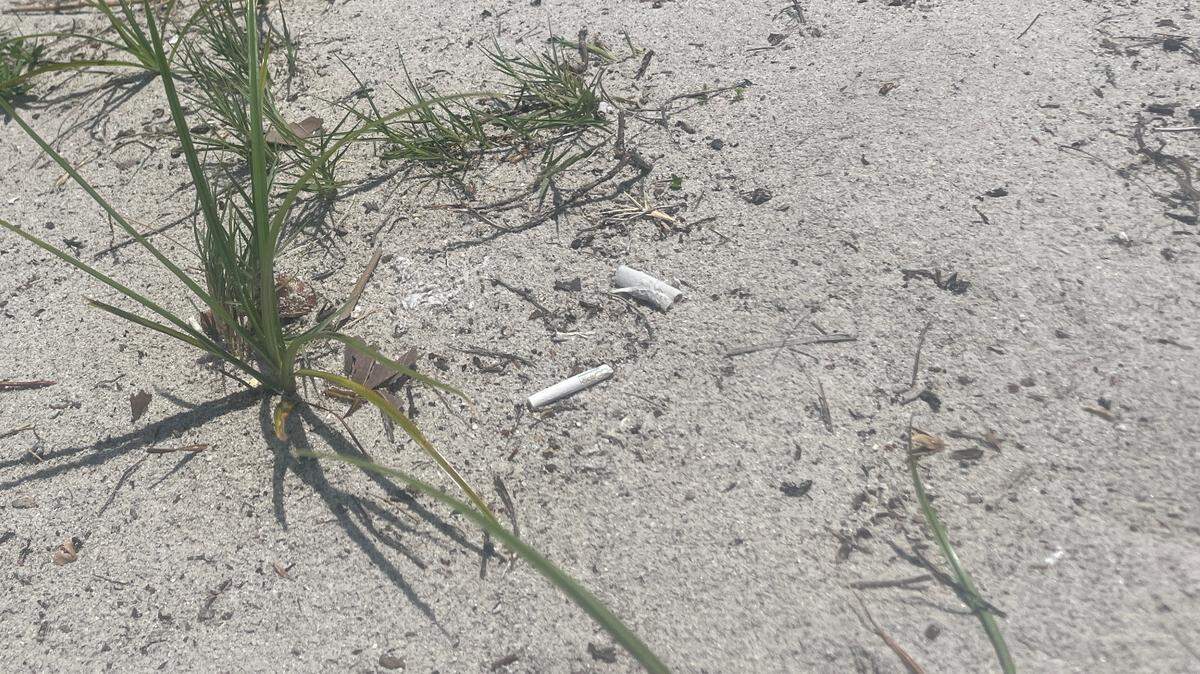 Cigarette butts are left behind as litter on Crandon Park Beach on Wednesday, June 21, 2023, the day the Miami-Dade County Commission passed an ordinance banning cigarette smoking on county beaches.