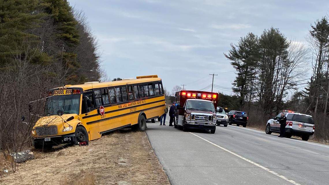 This photo provided by the Topsham Police Department shows a school bus that students steered to safety after the 77-year-old male driver suffered a medical event that left him incapacitated, Monday, March 14, 2022, in Topsham, Maine.