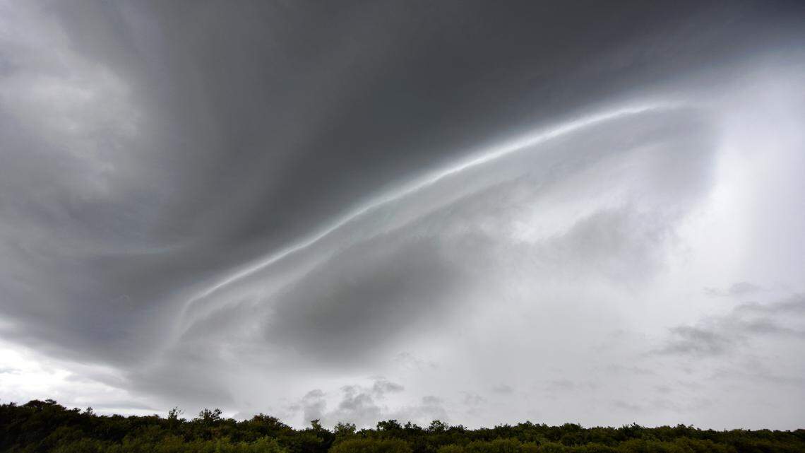A shelf cloud starts forming over the Yi River near Capilla del Sauce, Florida Department, some 185 km north of Montevideo, on February 5, 2025. (Photo by Mariana SUAREZ / AFP) (Photo by MARIANA SUAREZ/AFP via Getty Images)