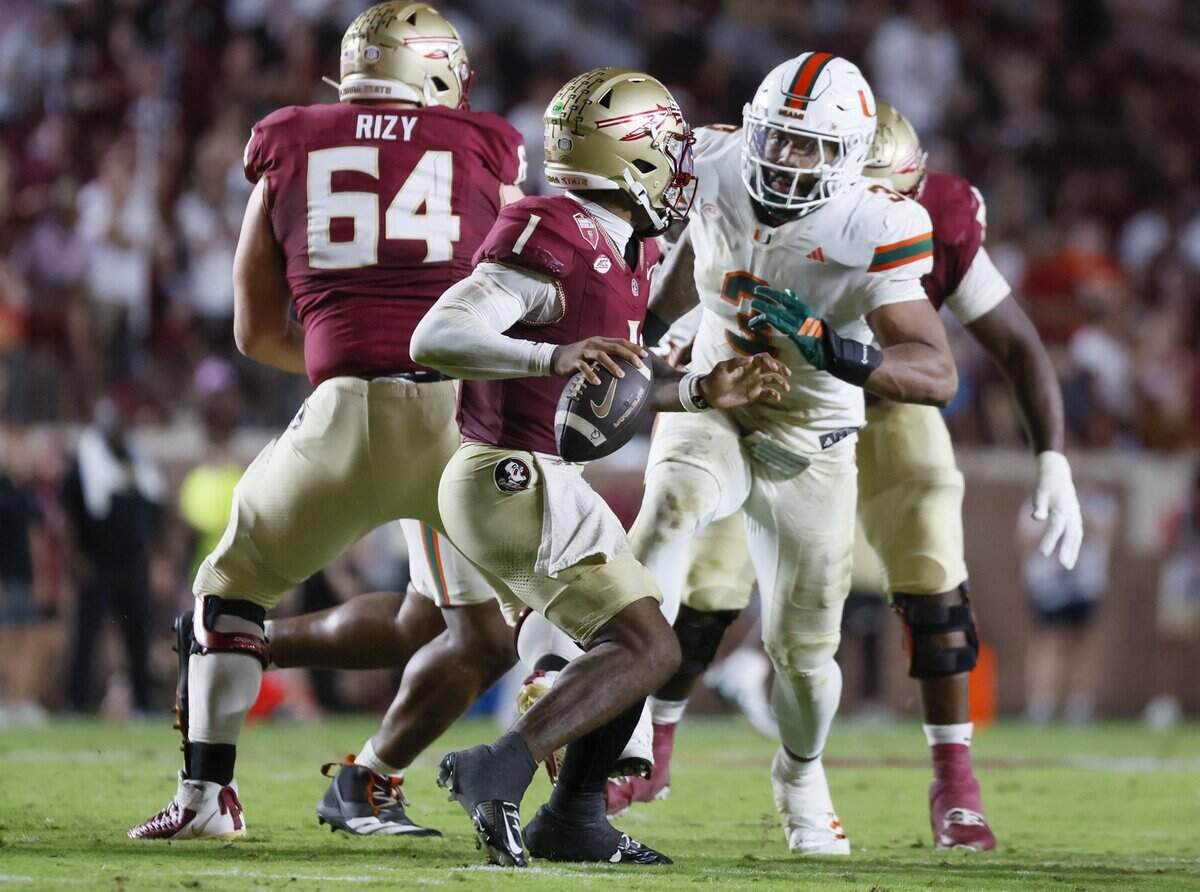 Miami Hurricanes defensive lineman Akheem Mesidor (3) sacks Florida State Seminoles quarterback Tommy Castellanos (1) in the first half of the NCAA game against the Florida State Seminoles at Doak Campbell Stadium in Tallahassee, Florida, on Saturday, October 4, 2025.
