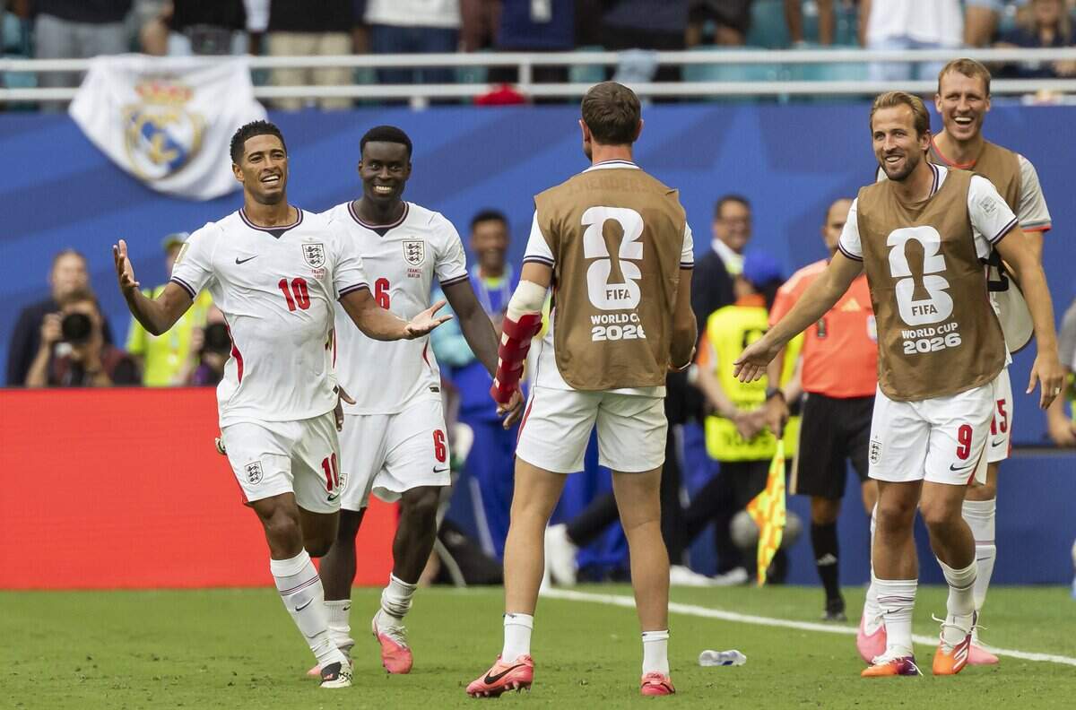 England midfielder Jude Bellingham (10) celebrates with his teammates after scoring a goal against France in the second half of their FIFA World Cup 2026 third-place soccer match at Hard Rock Stadium (Miami Stadium) on Saturday, July 18, 2026 in Miami Gardens, Fla.
