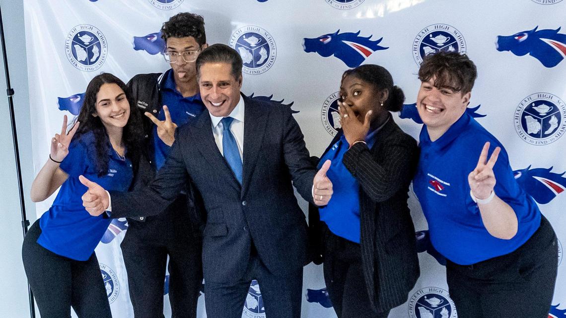 Alberto Carvalho poses for photos with Hialeah Senior High School students during his visit to the school on Feb. 3 2022.