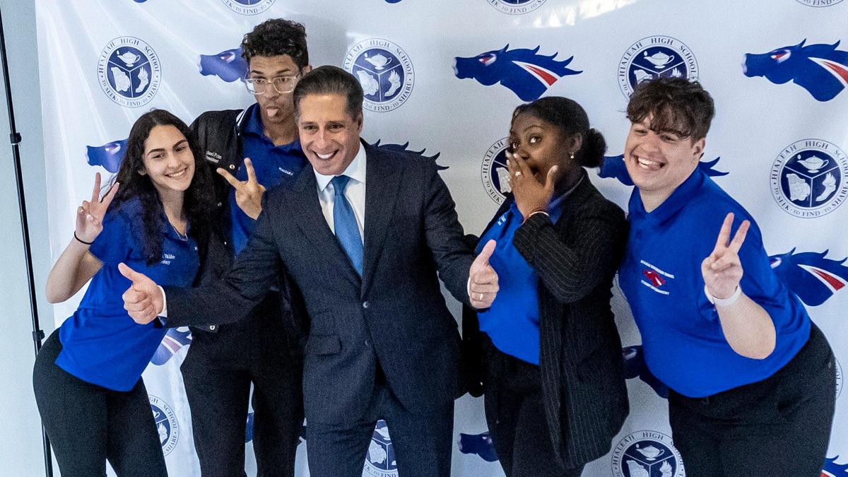 Alberto Carvalho poses for photos with Hialeah Senior High School students during his visit to the school on Feb. 3, 2022.