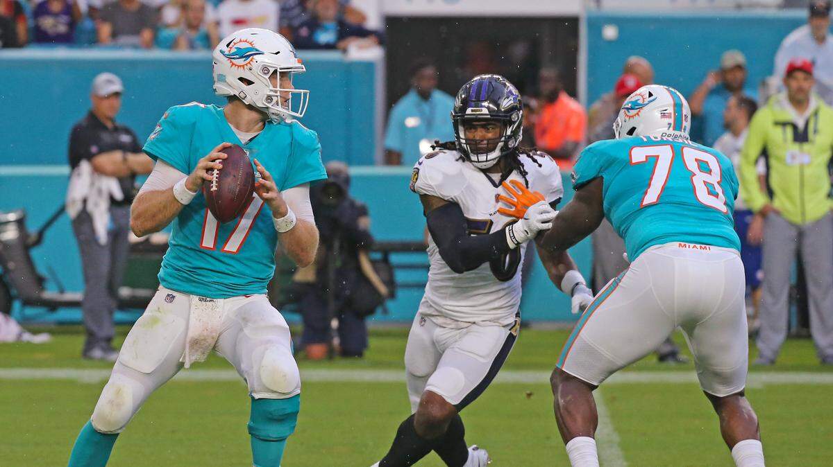 Miami Dolphins quarterback Ryan Tannehills attempt to throw as Dolphins offensive tackle Laremy Tunsil blocks Baltimore Ravens linebacker Tim Williams during an Aug. 25 preseason game.