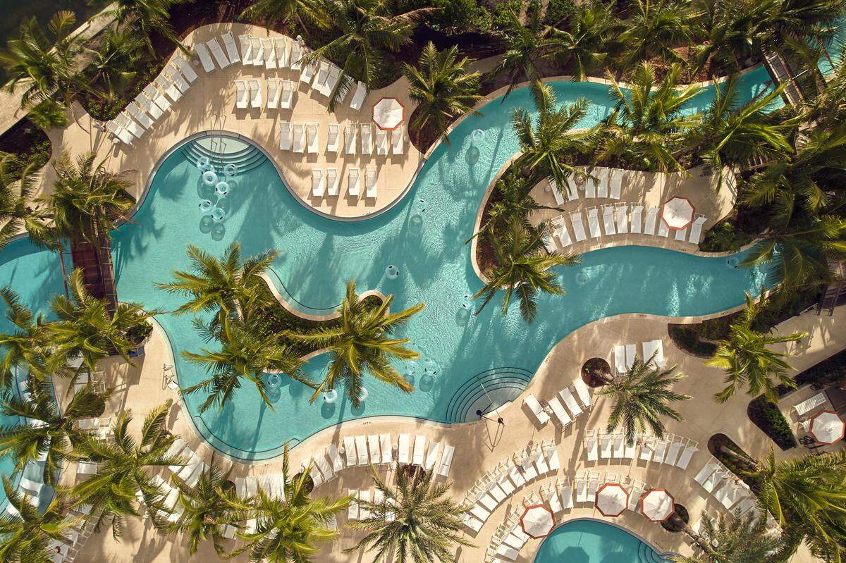 The Boca Raton’s Harborside Pool Club is an ideal relaxation spot where guests can drift down the lazy river.