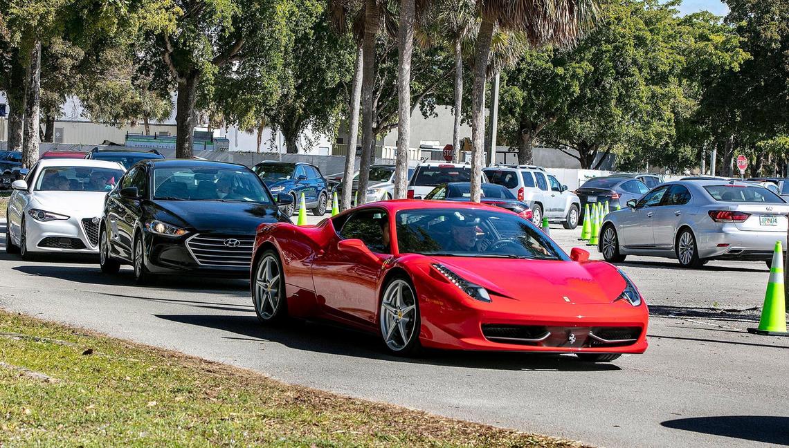Long lines of cars are seen as people with appointments get the COVID vaccine at Tropical Park Covid test site.The Florida Highway Patrol and Miami-Dade Police urged drivers to avoid a portion of Bird Road because large crowds hoping to get the COVID-19 vaccine at the park is leading to traffic jams, as Coronavirus numbers surge in Miami-Dade County, on Saturday, January 09, 2021.