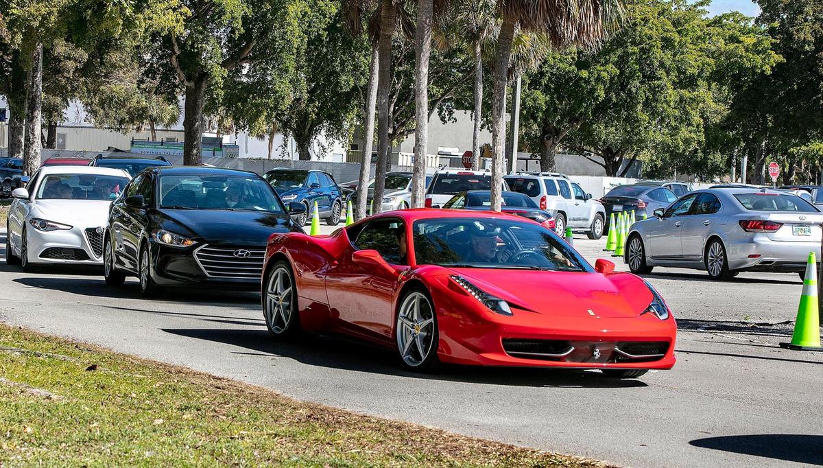 Long lines of cars are seen as people with appointments get the COVID vaccine at Tropical Park Covid test site.The Florida Highway Patrol and Miami-Dade Police urged drivers to avoid a portion of Bird Road because large crowds hoping to get the COVID-19 vaccine at the park is leading to traffic jams, as Coronavirus numbers surge in Miami-Dade County, on Saturday, January 09, 2021.
