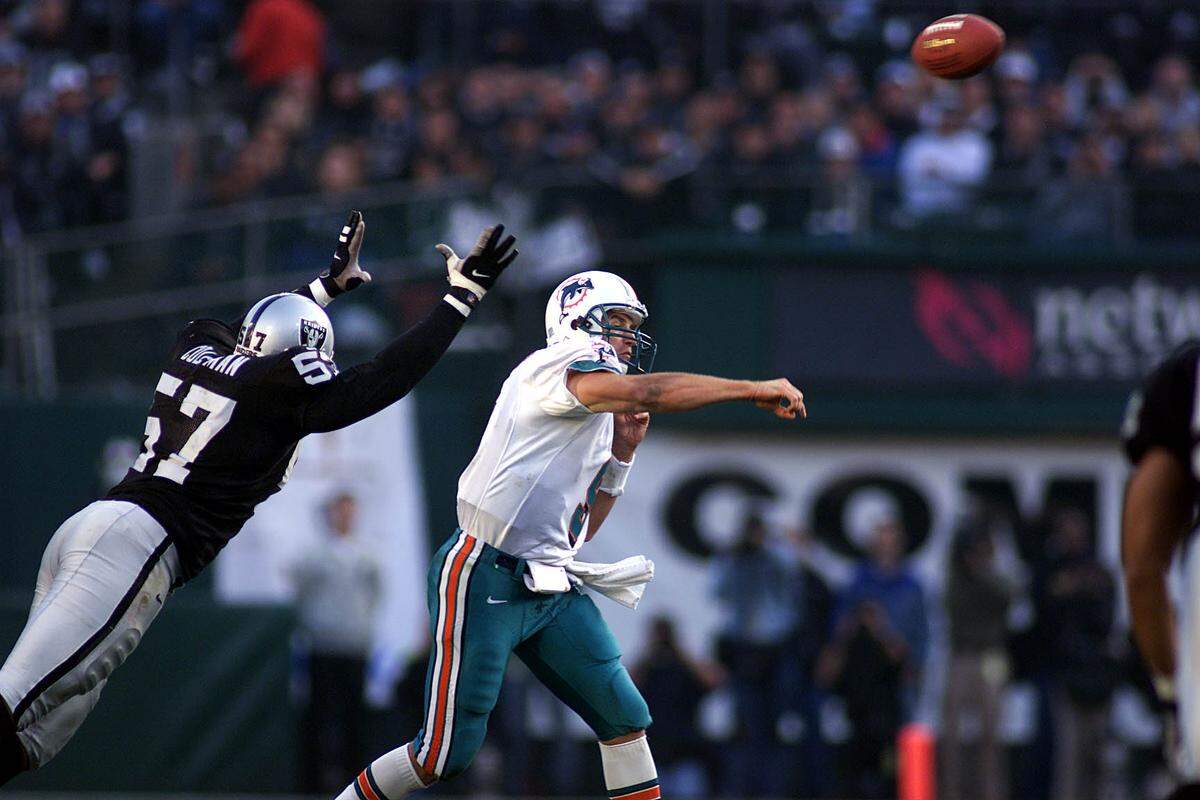 The Miami Dolphins play the Oakland Raiders in Oakland..In QT # 4 Jay Fielder is under pressure by Roderick Coleman and throws incomplete to O.J. McDuffie.
