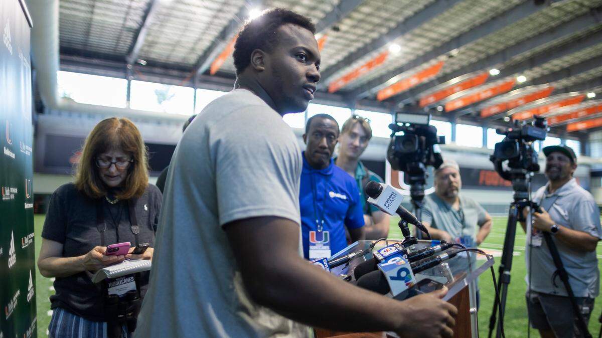 Miami Hurricanes defensive lineman Rueben Bain, Jr. (4) speaks to members of the press after attending team practice inside the Carol Soffer Indoor Practice Facility at the University of Miami on Monday, March 4, 2023 in Coral Gables, Fla.