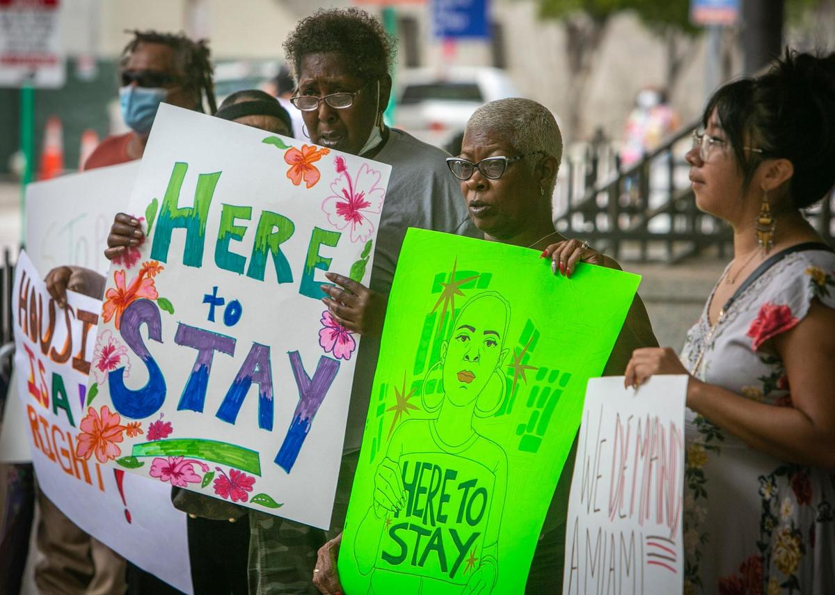 Demonstrators chant slogans during a rally in front of the Stephen Clark Government Center in downtown Miami on July 20, 2021.