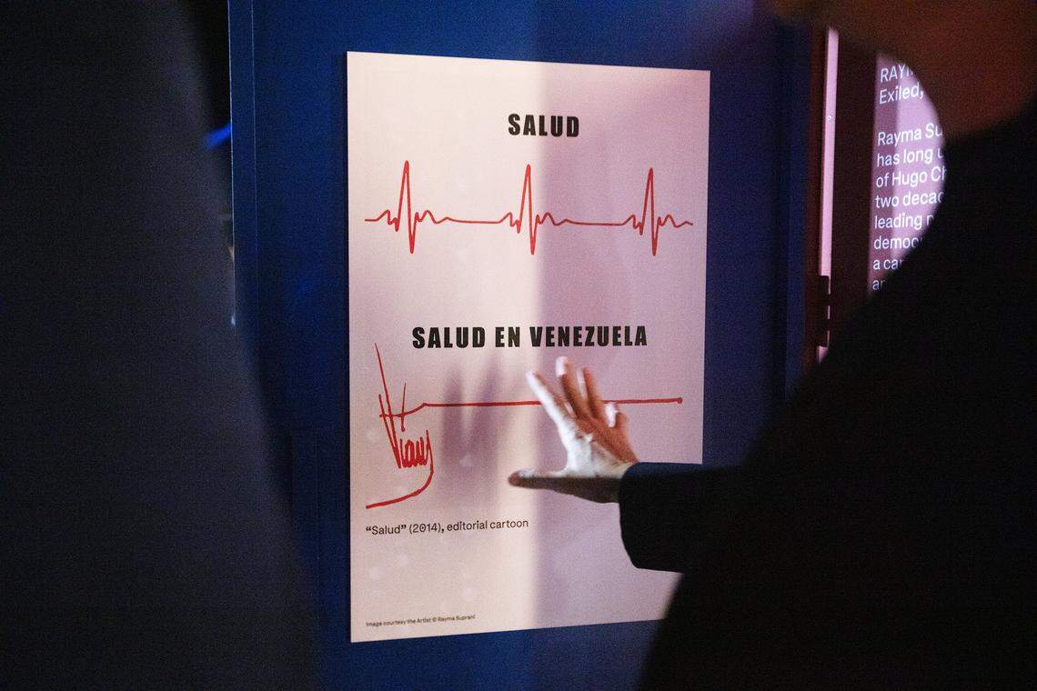 Miami Beach, Florida, December 1, 2025 - Artist Rayma Suprani a Venezuelan political cartoonist talks about her art at the “Doors to Freedom” installation, a new Art Week installation unveiled by The Human Rights Foundation, Cuban Freedom March, and the City of Miami Beach.