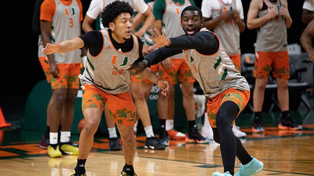 Nijel Pack (24) and Bensley Joseph (4) run a drill during practice on Monday, Oct. 23, 2023, at the practice facility at Watsco Center in Coral Gables.