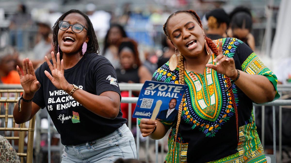 Sisters, Saisha Delevoe and Anna Delevoe, left to right, dance to the music during the 2024 Juneteenth Park-In and Party Celebration under this year’s theme, “America Keeps Its Promise of Freedom For All!” at Hard Rock Stadium in Miami Gardens, Florida on Saturday, June 15, 2024.