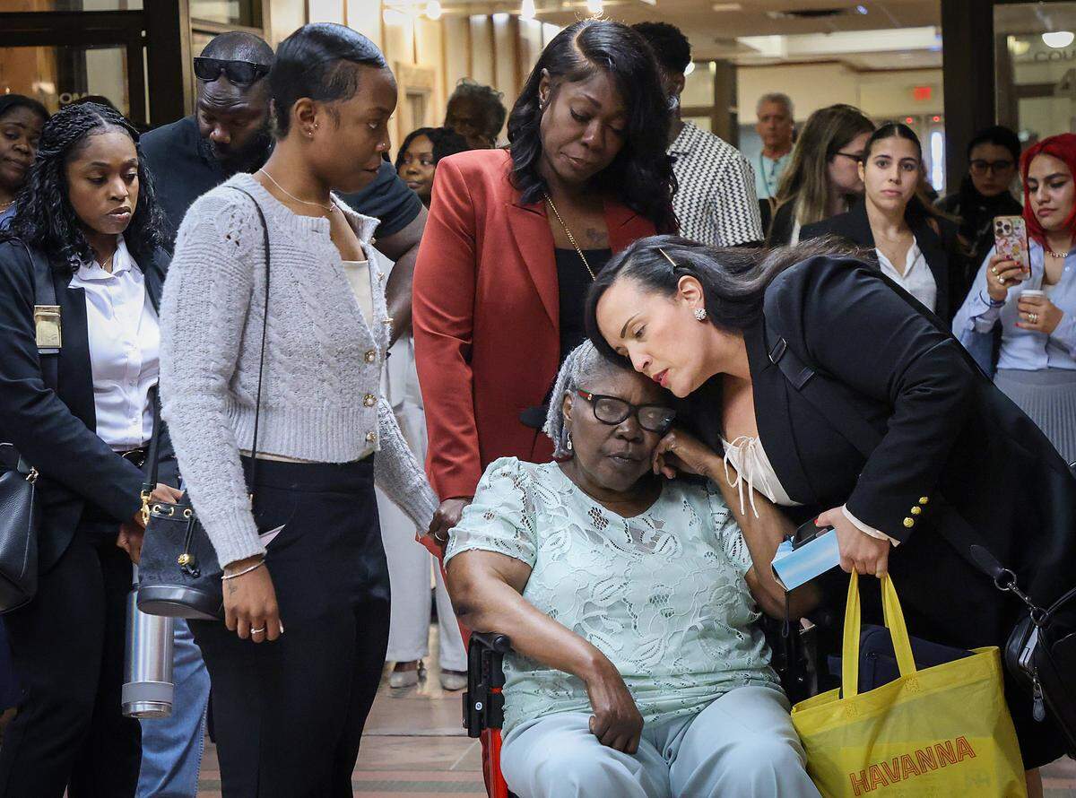 POOL PHOTO: Jeanette Pata, the mother of Bryan Pata, is comforted by her daughter and a victim advocate after a mistrial was declared in the case of Rashaun Jones, who is accused of Pata, his former University of Miami football teammate in the hallway outside the Judge Cristina Miranda Courtroom 4-1 at the Richard E. Gerstein Justice Building in Miami, FL, on Monday, March 2, 2026.
