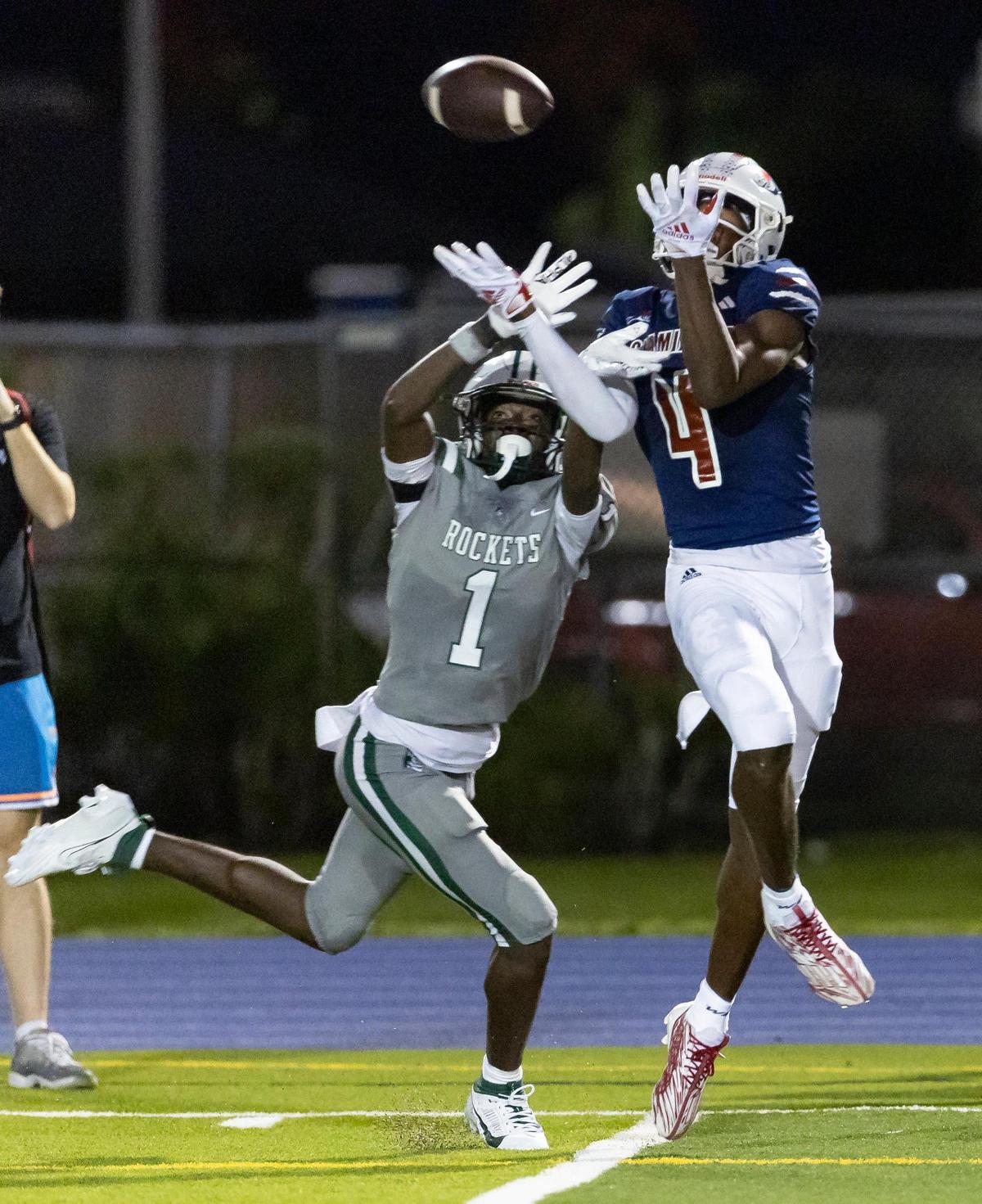 Central Rockets wide receiver Lawayne McCoy (1) prevents Chaminade-Madonna Lions wide receiver Jeremiah Smith (4) from catching the ball in the first quarter of their high school football game at the Nathaniel Traz Powell Stadium on Thursday, Sept. 21, 2023, in Miami, Fla.
