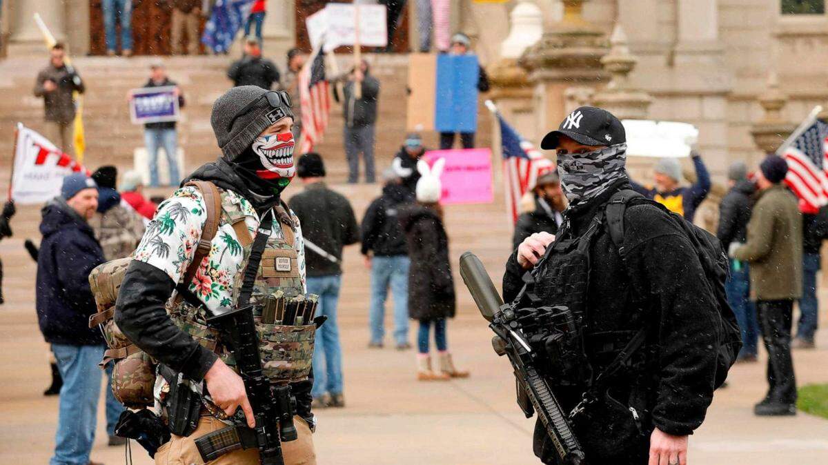 Armed protesters taking part in a protest organized by “Michiganders Against Excessive Quarantine” converged at the State Capitol in Lansing on April 15.