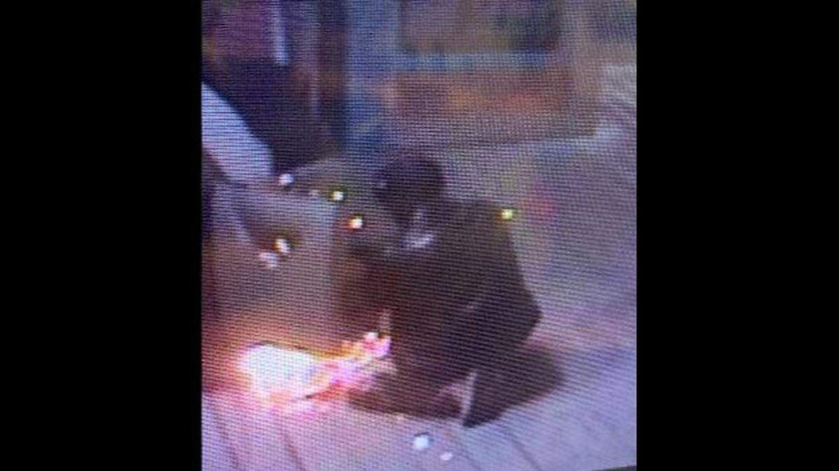 Okaloosa County Sheriff’s Office released this surveillance video image of a man in a black half nose mask with black sunglasses, a black leather style jacket, camo pants, desert tan military style boots, and black gloves, using a blow torch to try and break into a safe on May 31, 2019.
