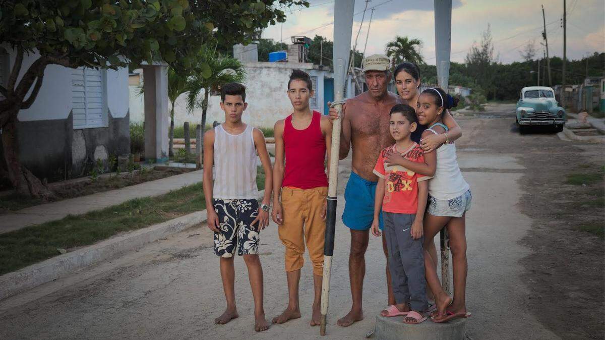 This Cuban family is torn by the mother’s desire to seek a better life in the United States and the father’s ties to family and friends still in Cuba and the fishing village where he was born. From left: Karel, Kevin, Orlando (Pita), Mariela with Orlandito, Cynthia.