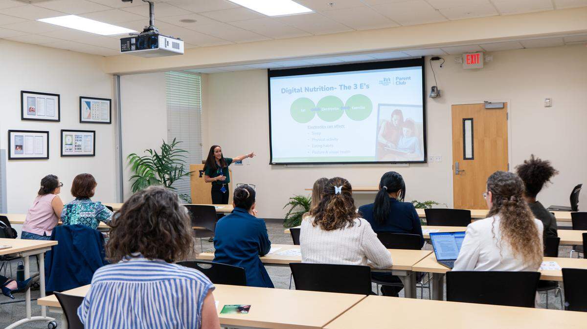 Carina Alvarez, a postdoctoral associate at FIU’s Center for Children and Families, leads the Let’s Talk Tech 2.0 workshop at the center on May 7.
