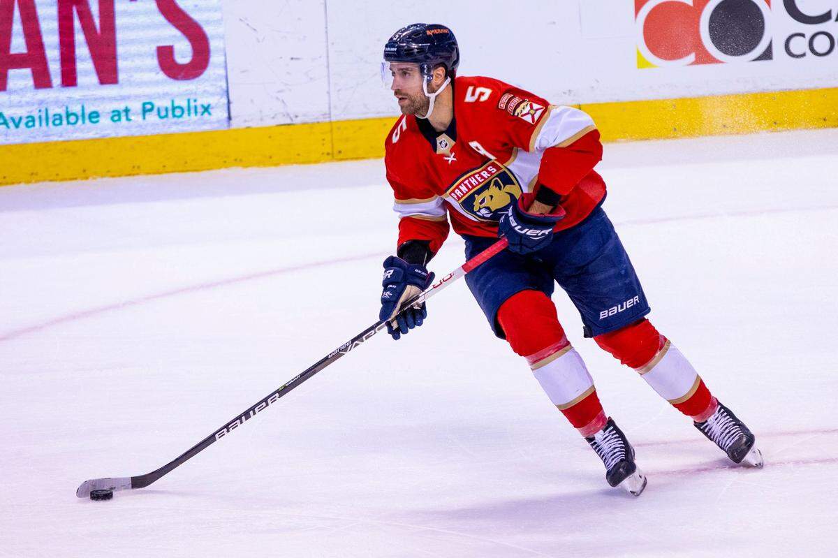 Florida Panthers defender Aaron Ekblad (5) controls the puck during the first period of an NHL game against the St. Louis Blues at FLA Live Arena in Sunrise, Florida, on Saturday, December 4, 2021.
