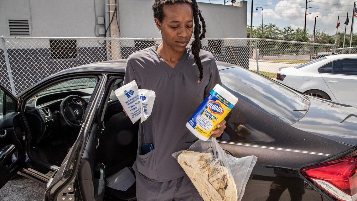 Homecare aide for Miami-Dade County Ashley Sanders has received very few supplies or protective gear against COVID-19 from employer as she cares for elderly patients on Friday, March 27, 2020.