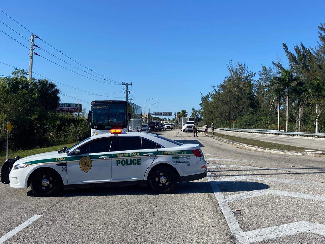 A Miami-Dade County Sheriff’s Office car blocks the southbound lanes of the 18 Mile Stretch of U.S. 1 in Florida City because of wildfires burning on the road to the Florida Keys Tuesday, March 18, 2025.