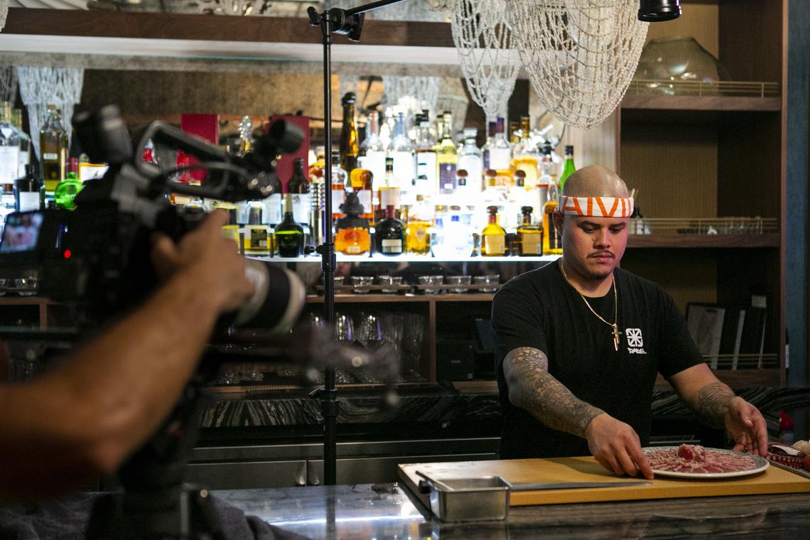 Chef and rapper Nando Chang, 30, prepares a Japanese Peruvian fusion dish while shooting a music video for his latest song “Sushi Chef” inside Kaido in the Design District in Miami on Saturday, March 16, 2019. Chang and his sister, Val Chang, have been nominated for a Rising Star James Beard award.