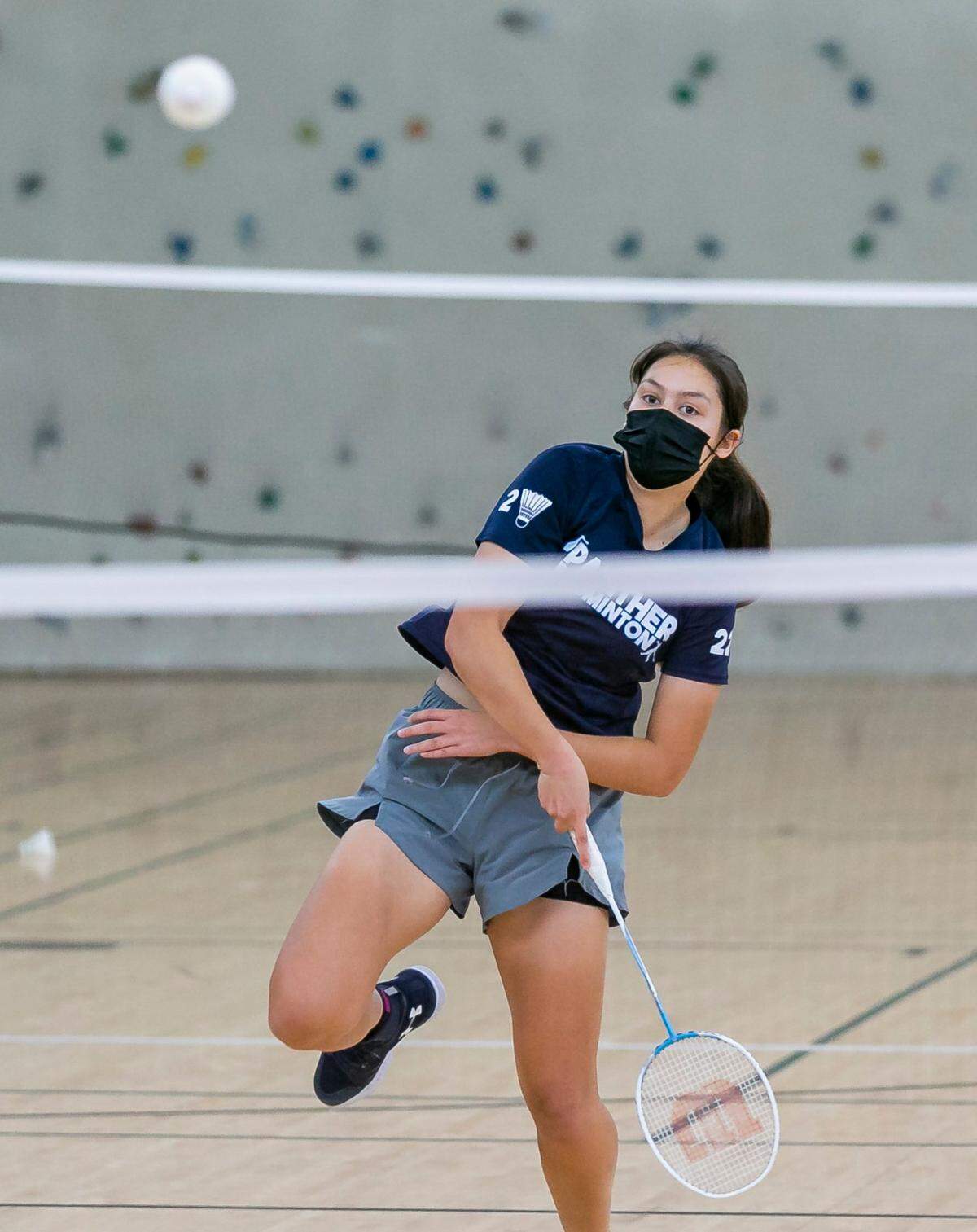 Katarina Slazas, 15, a freshman at Miami Palmetto Senior High School, returns a shot to Anabelle Calles, a freshman, at Barbara Goleman High School, during their badminton girls singles GMAC championship match at Barbara Goleman High School in Miami Lakes, Florida on Wednesday, April 20, 2022. Slazas defeated Calles 21 to 17 in their first set and 21 to 13 in their second set.