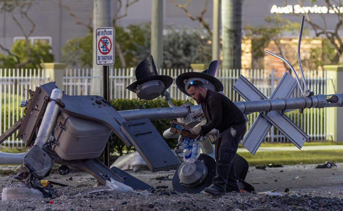 Crews clear debris after a vehicle and a Brightline train collided near the 14100 block of Biscayne Boulevard in North Miami on Wednesday, Nov. 19, 2025. One person was airlifted to a trauma center.