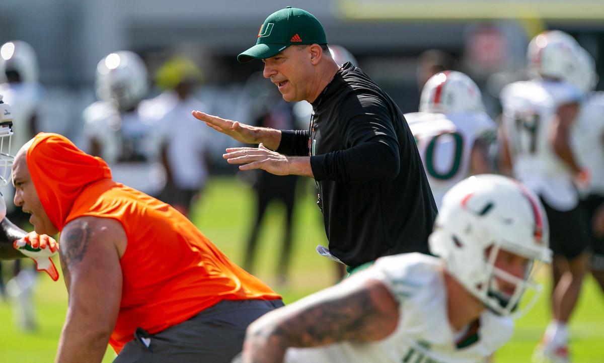 Miami Hurricanes Head Coach Mario Cristobal runs practice drills with his team at the University of Miami’s Greentree Practice Fields in Coral Gables, Florida on Monday, March 7, 2022.