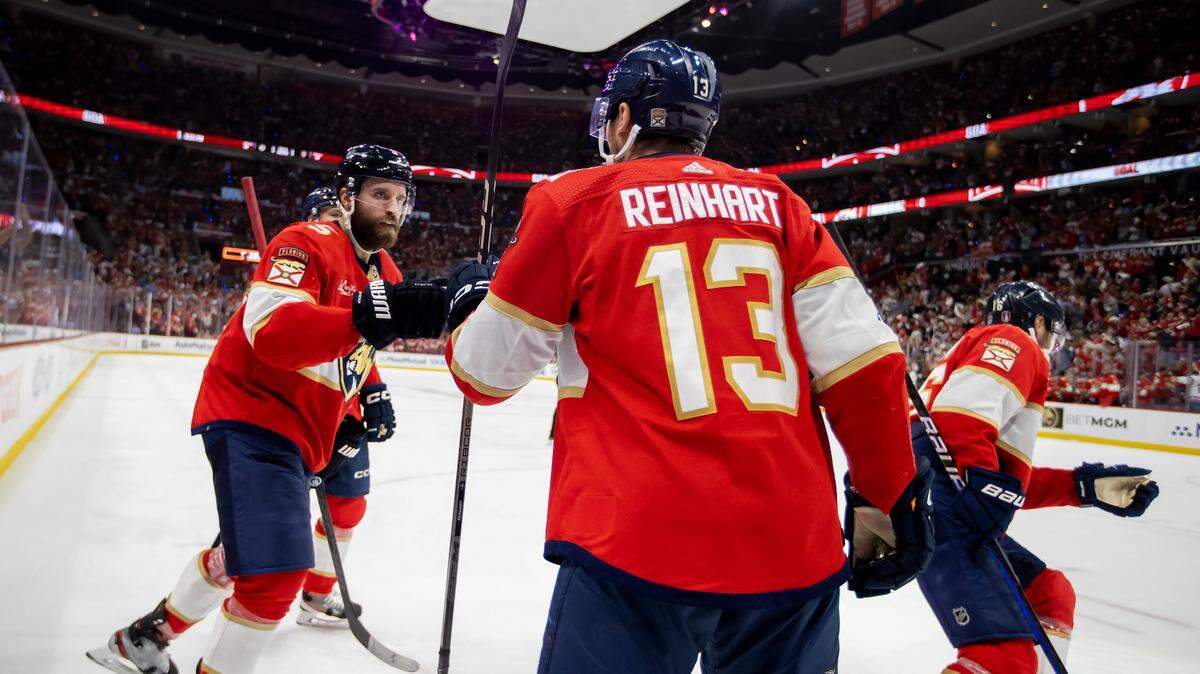 Florida Panthers defenseman Aaron Ekblad (5) celebrates with Panthers center Sam Reinhart (13) after his teammate, Panthers center Aleksander Barkov (16), scored a goal in the second period of Game 2 of the Stanley Cup Playoffs second-round series against Boston. Bruins at Amerant Bank Arena on Wednesday, May 8, 2024 in Sunrise, Florida.