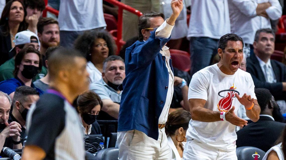 Miami Mayor Francis X. Suarez, right, and technology entrepreneur Sean Wolfington, left, react from courtside during the first quarter of Game 1 of the NBA Eastern Conference Finals series between the Miami Heat and the Boston Celtics at FTX Arena in Miami on Tuesday, May 17, 2022.