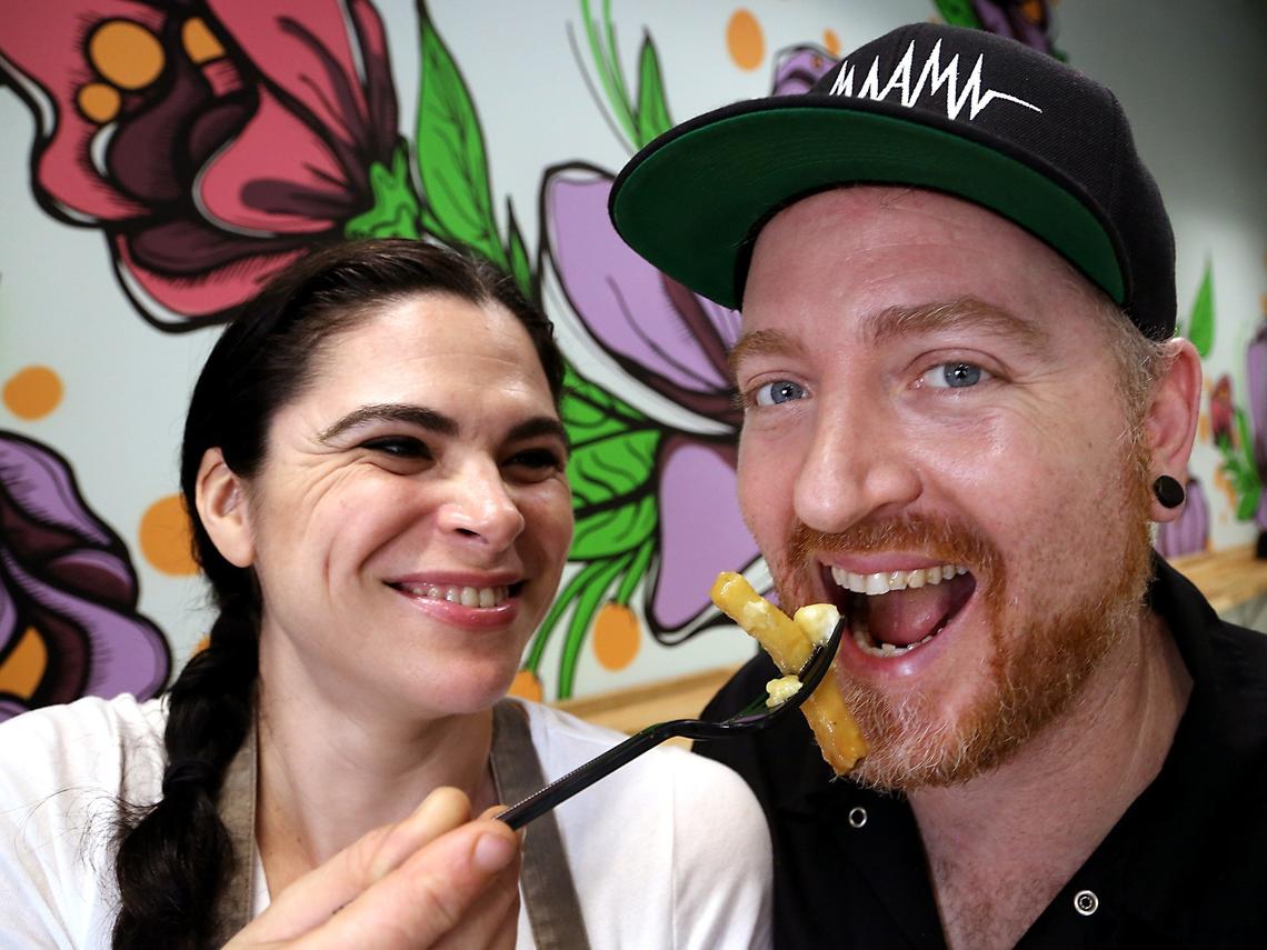 Melanie and husband Jason, right, Schoendorfer are photographed at their Pinecrest business which they started as a husband-and-wife butcher shop named Babe’s Meat & Counter in Pinecrest. They smoke and cure all their own meats and sausages, and once a week, they make the French Canadian dish, “poutine” at their butcher shop.