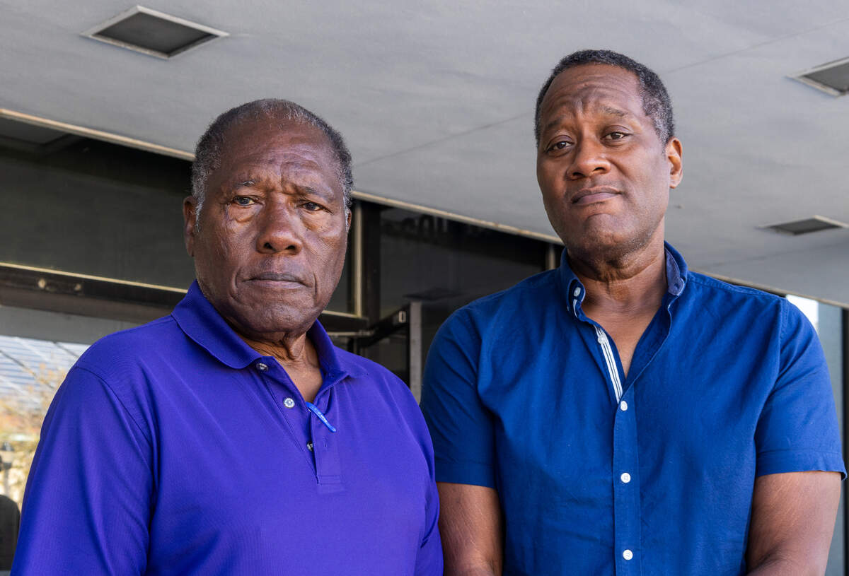 Historian Marvin Dunn, left, and his son Frederick Dunn, right, stand outside of the U.S. Federal Court House in Gainesville, Fla., after David Emmanuel’s sentencing in Oct. 19, 2023.
