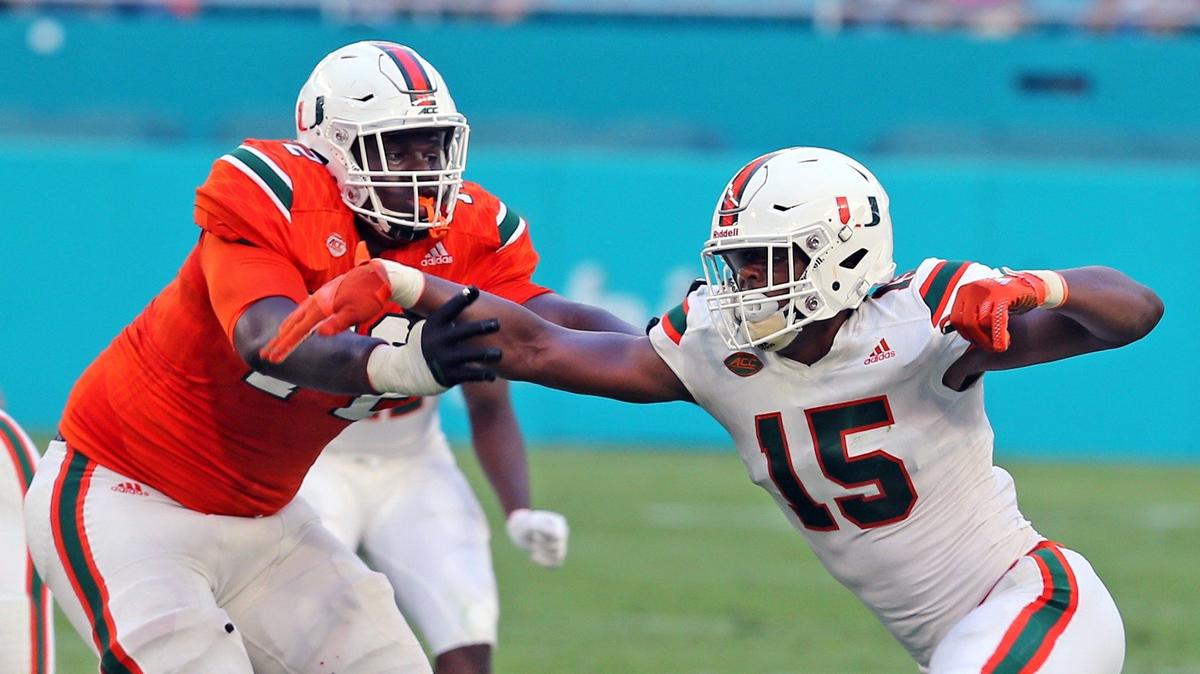 Miami Hurricanes defensive end Greg Rousseau - seen here rushing against teammate John Campbell in UM’s spring game - is back after missing most of last season with a fractured right ankle.