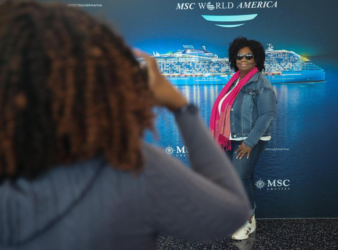 What’s a cruise without am entrance photo? Travel agent Holly Aaron, left, captures a moment with Sharann Chester, right, before boarding MSC World America.