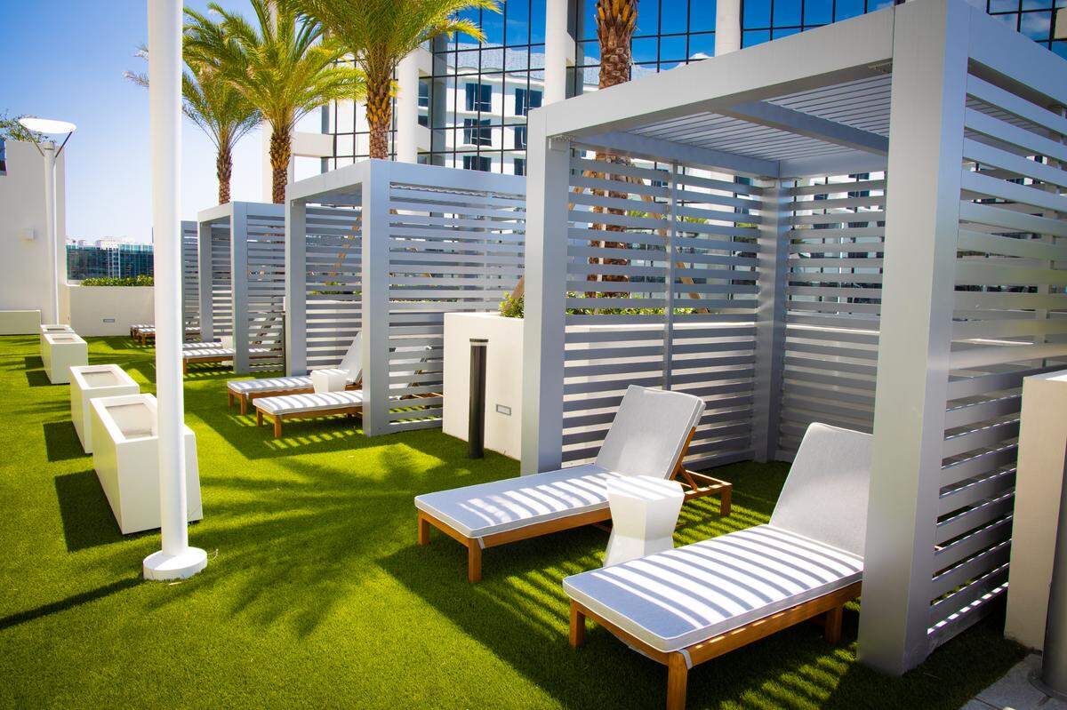 Cabanas at the Hilton Aventura Miami on the seventh-floor pool deck, which also is home to a pool bar.