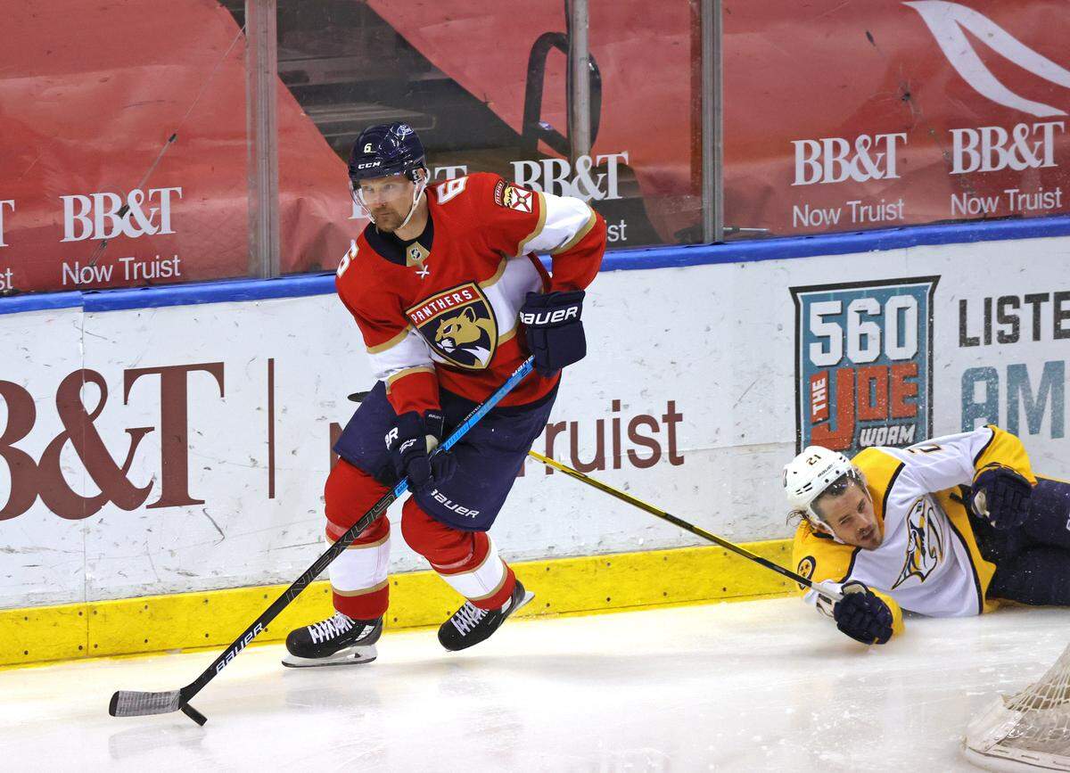 Florida Panthers defenseman Anton Stralman (6) carries the puck against Nashville Predators center Nick Cousins (21) during the second period of their NHL game at the BB&T Center on Thursday, March 18, 2021 in Sunrise, Fl.