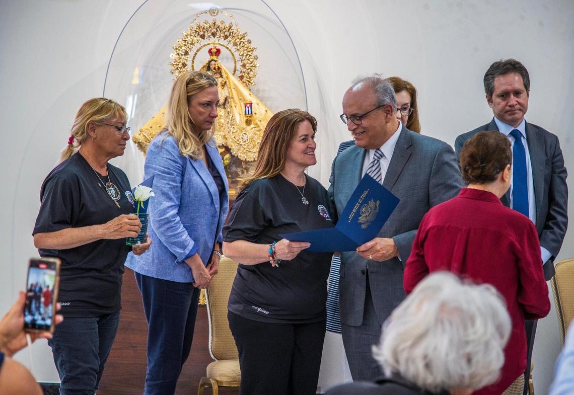 Frank Mora, U.S. Ambassador to the Organization of American States, presents a letter from U.S. Secretary of State Antony Blinken to Maritza Lugo (far left) and Carmen Julia Arias Yglesias, part of a group of Cuban women former political prisoners,during an event organized by the Cuban American Bar Association (CABA), to call for the Release of Women Political Prisoners in Cuba.