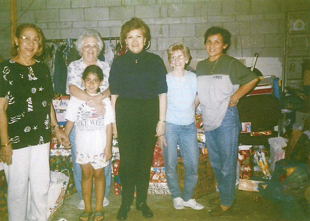 Norma Borgono, far right, participates in a Christmas-related charitable event at her church.