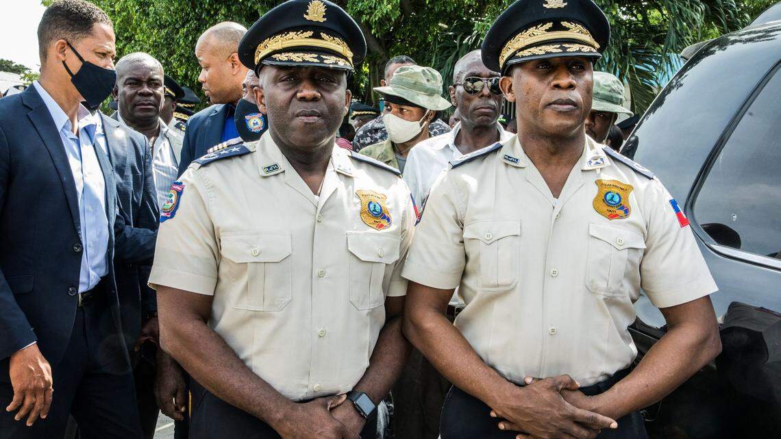 The new director general of the Haiti National Police, Léon Charles, left, and outgoing police director Rameau Normil attend a ceremony in Port-au-Prince, Haiti, on November 16, 2020.